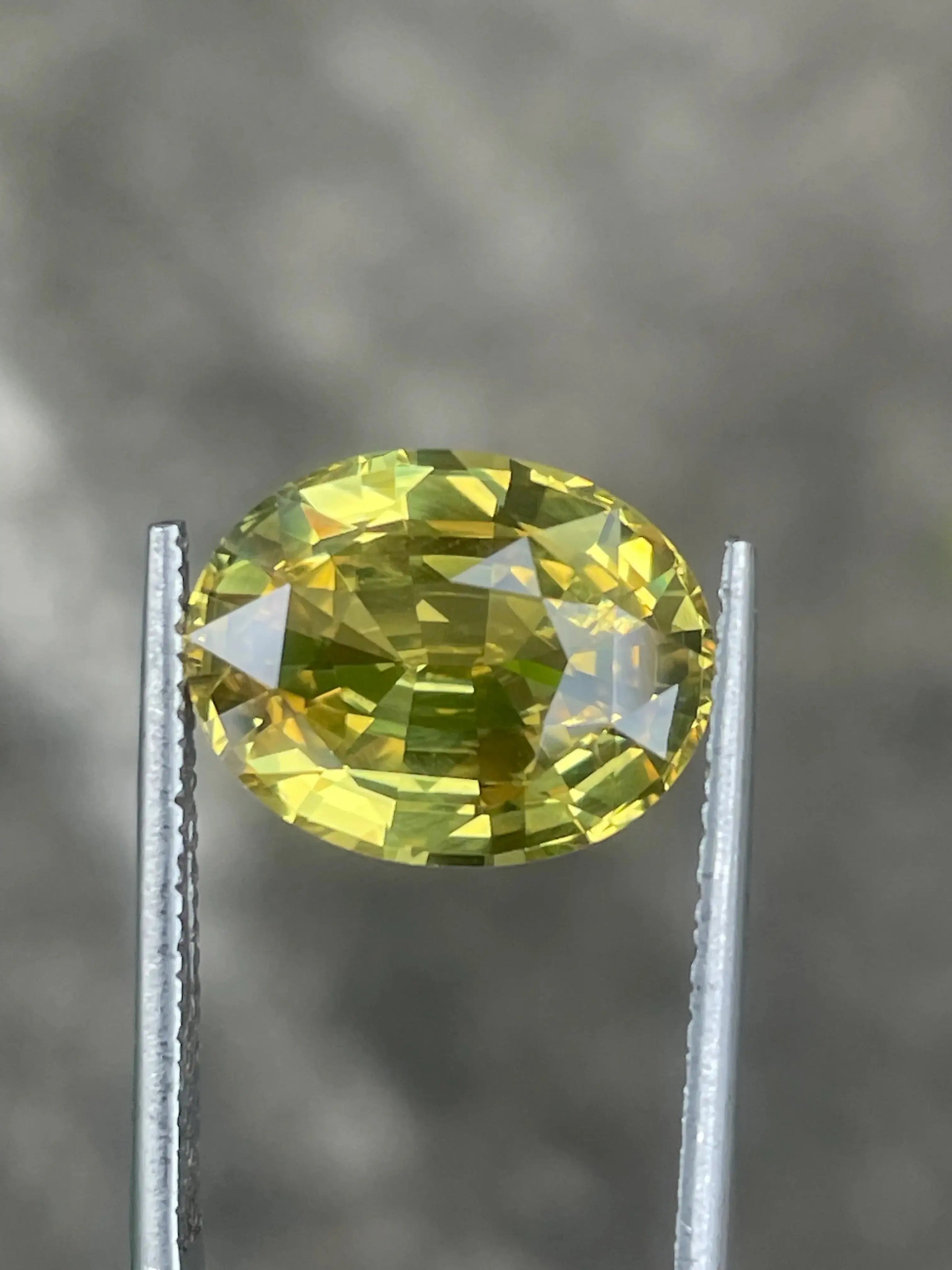 Natural oval  cut yellow sapphire with vivid lemon-gold saturation, ethically sourced from Sri Lanka - Crystal Gem & Jewelry