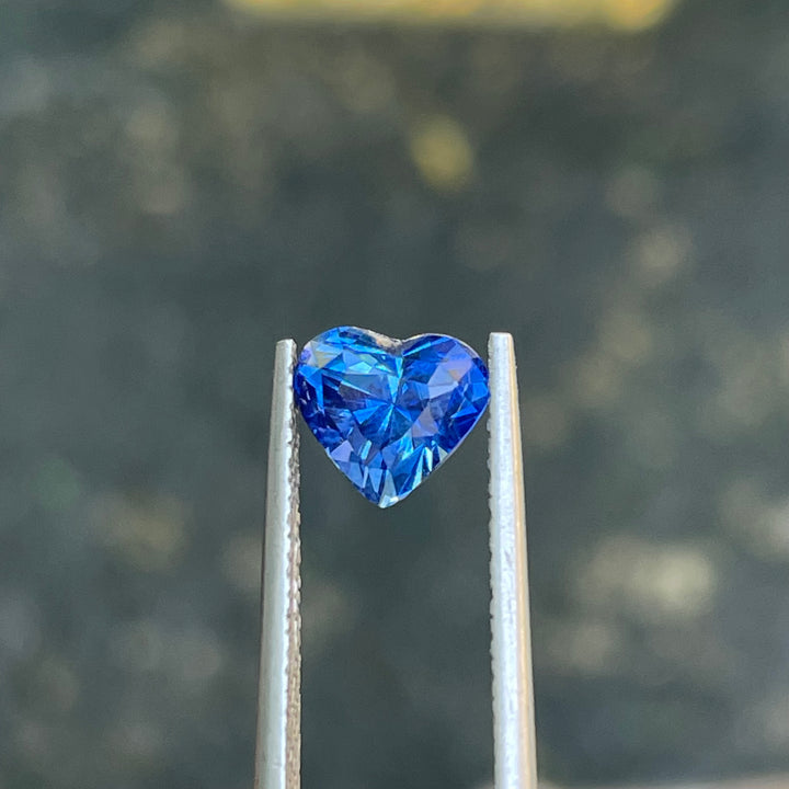 Natural 2.02 carat heart-shaped blue sapphire from Madagascar, measuring 7.8 × 7 × 5.5 mm, clean appearance, heated loose earth-mined gemstone by Crystal Gem &amp; Jewelry.