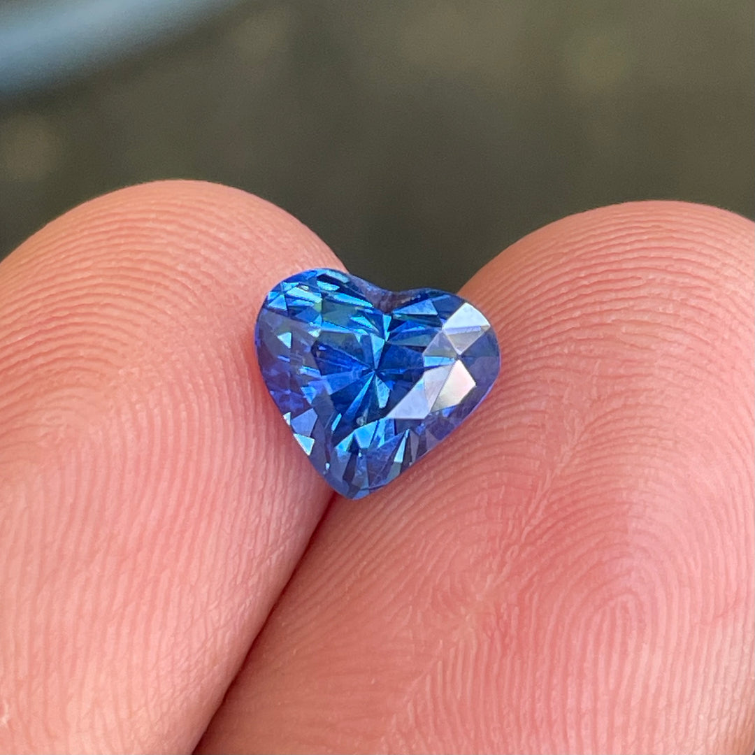 Natural 2.02 carat heart-shaped blue sapphire from Madagascar, measuring 7.8 × 7 × 5.5 mm, clean appearance, heated loose earth-mined gemstone by Crystal Gem &amp; Jewelry.
