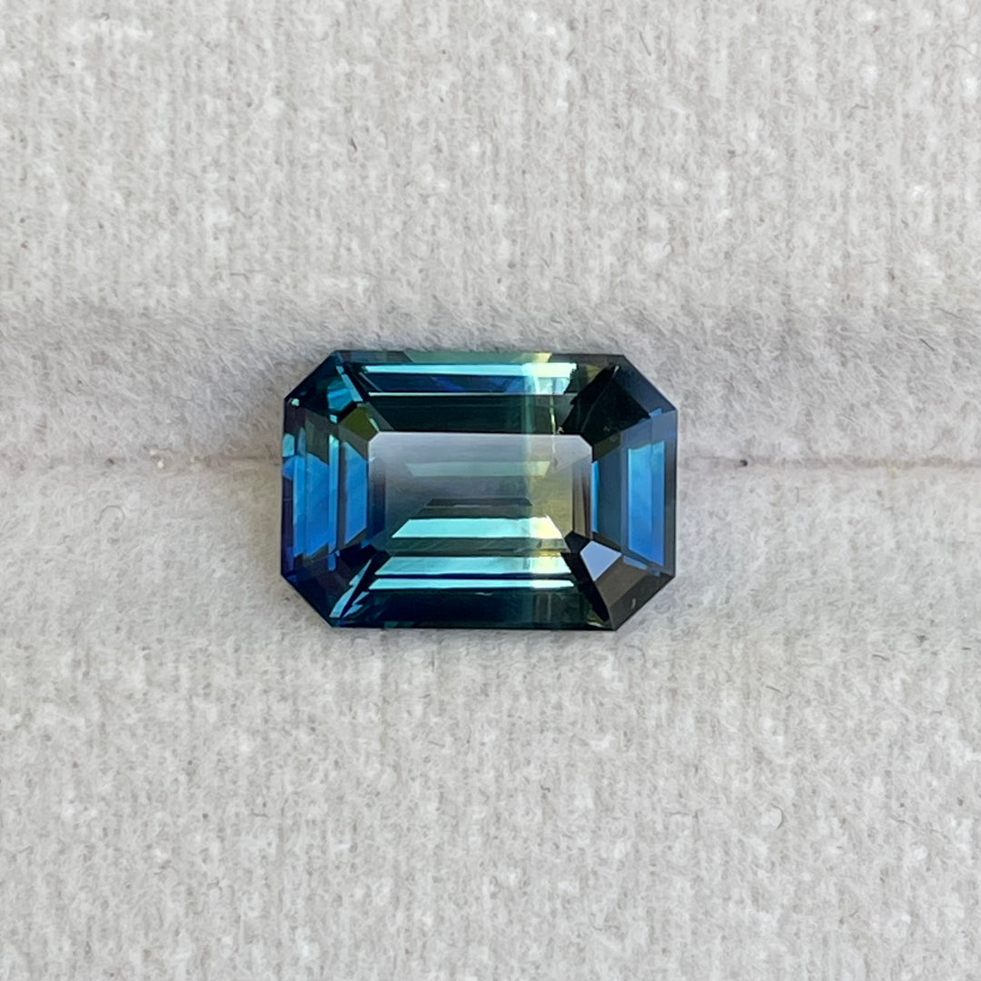 Natural 3.06 carat parti sapphire from Madagascar, emerald shape, unheated, with a 100% clean appearance as described, measuring 9.8 × 7.0 × 4.4 mm, by Crystal Gem &amp; Jewelry.