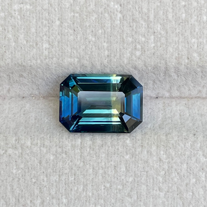 Natural 3.06 carat parti sapphire from Madagascar, emerald shape, unheated, with a 100% clean appearance as described, measuring 9.8 × 7.0 × 4.4 mm, by Crystal Gem &amp; Jewelry.