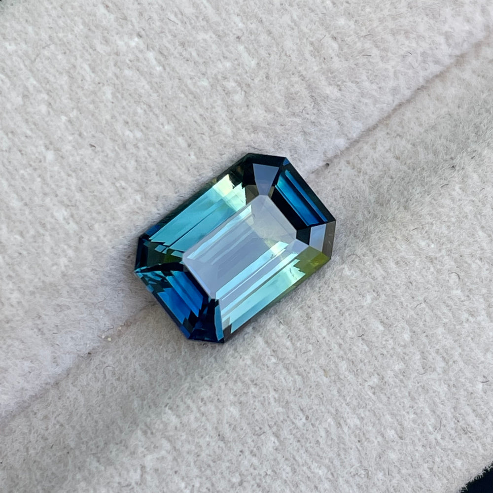Natural 3.06 carat parti sapphire from Madagascar, emerald shape, unheated, with a 100% clean appearance as described, measuring 9.8 × 7.0 × 4.4 mm, by Crystal Gem & Jewelry.