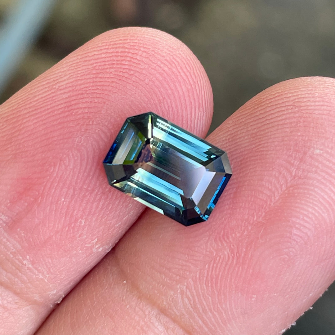 Natural 3.06 carat parti sapphire from Madagascar, emerald shape, unheated, with a 100% clean appearance as described, measuring 9.8 × 7.0 × 4.4 mm, by Crystal Gem &amp; Jewelry.