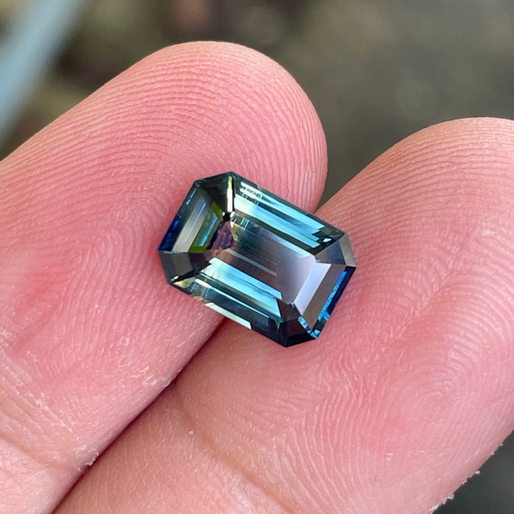 Natural 3.06 carat parti sapphire from Madagascar, emerald shape, unheated, with a 100% clean appearance as described, measuring 9.8 × 7.0 × 4.4 mm, by Crystal Gem &amp; Jewelry.
