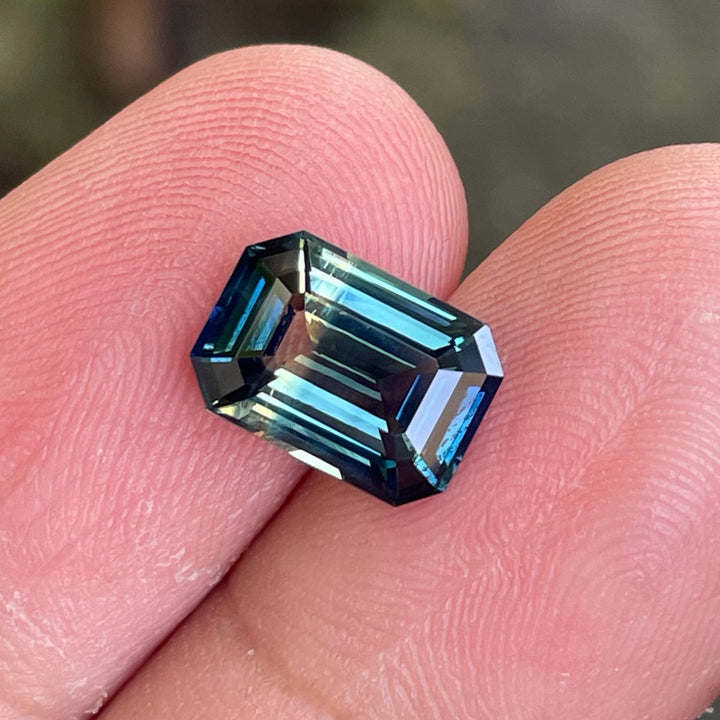 Natural 3.06 carat parti sapphire from Madagascar, emerald shape, unheated, with a 100% clean appearance as described, measuring 9.8 × 7.0 × 4.4 mm, by Crystal Gem &amp; Jewelry.
