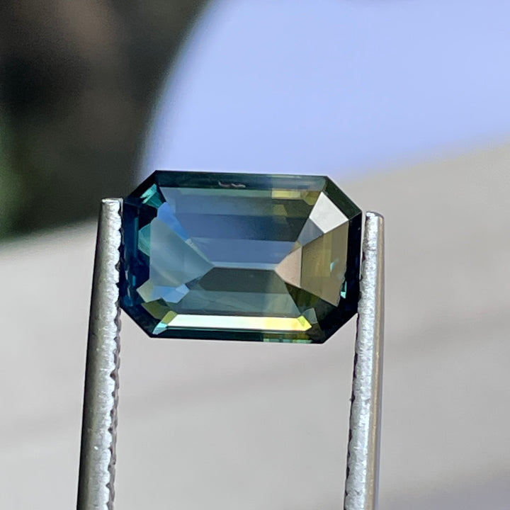 Natural 3.06 carat parti sapphire from Madagascar, emerald shape, unheated, with a 100% clean appearance as described, measuring 9.8 × 7.0 × 4.4 mm, by Crystal Gem &amp; Jewelry.
