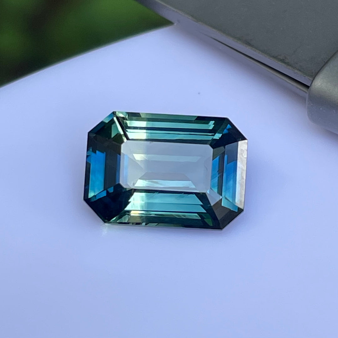 Natural 3.06 carat parti sapphire from Madagascar, emerald shape, unheated, with a 100% clean appearance as described, measuring 9.8 × 7.0 × 4.4 mm, by Crystal Gem &amp; Jewelry.