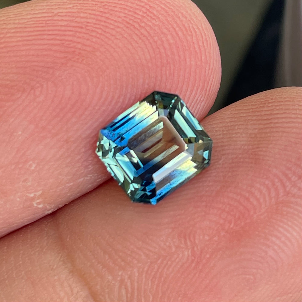 Natural 2.08 carat parti sapphire from Madagascar, cushion cut, unheated with a clean appearance, measuring 7.3 × 6.3 × 4.0 mm, loose earth-mined gemstone by Crystal Gem & Jewelry.