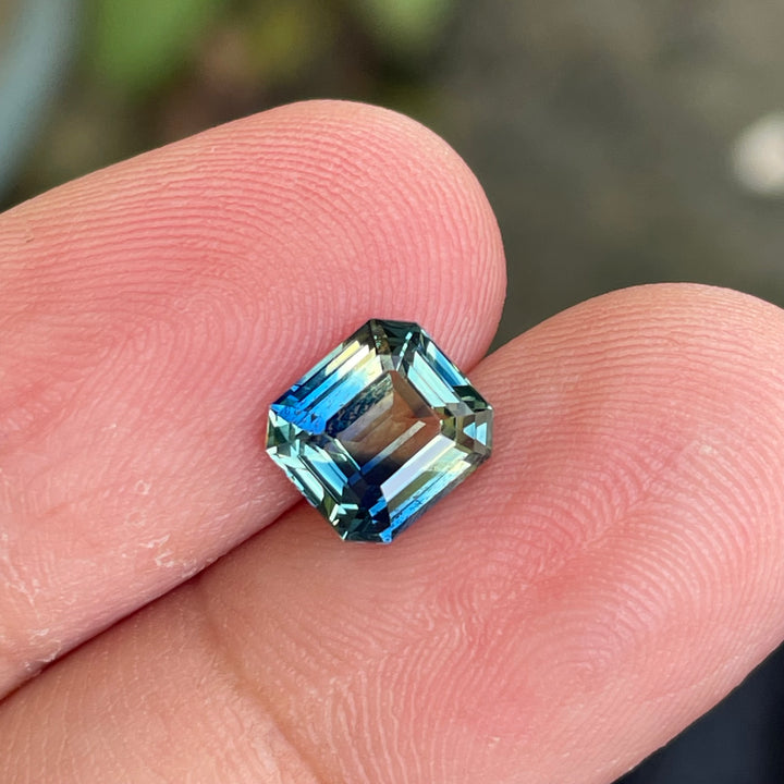 Natural 2.08 carat parti sapphire from Madagascar, cushion cut, unheated with a clean appearance, measuring 7.3 × 6.3 × 4.0 mm, loose earth-mined gemstone by Crystal Gem &amp; Jewelry.