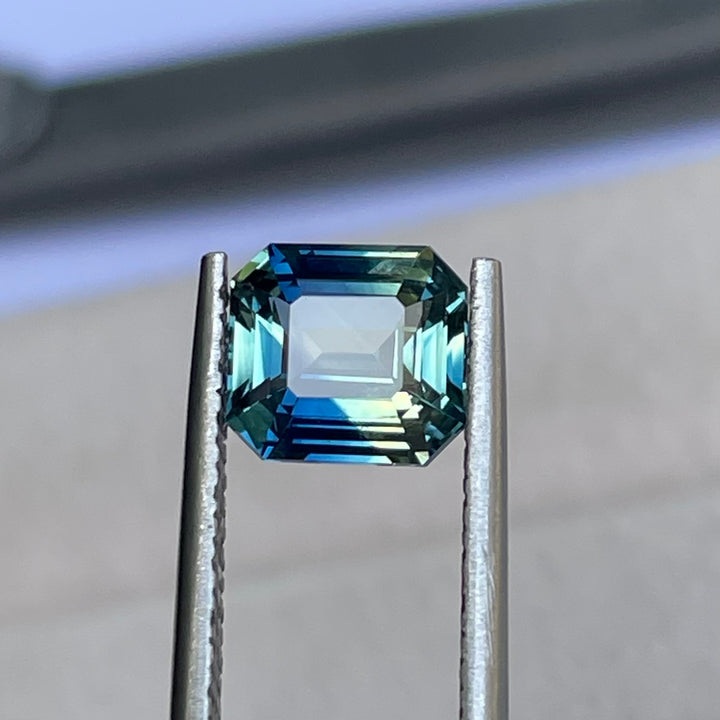 Natural 2.08 carat parti sapphire from Madagascar, cushion cut, unheated with a clean appearance, measuring 7.3 × 6.3 × 4.0 mm, loose earth-mined gemstone by Crystal Gem &amp; Jewelry.