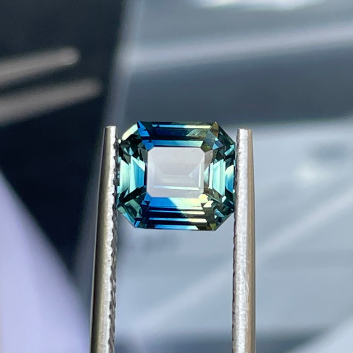 Natural 2.08 carat parti sapphire from Madagascar, cushion cut, unheated with a clean appearance, measuring 7.3 × 6.3 × 4.0 mm, loose earth-mined gemstone by Crystal Gem &amp; Jewelry.