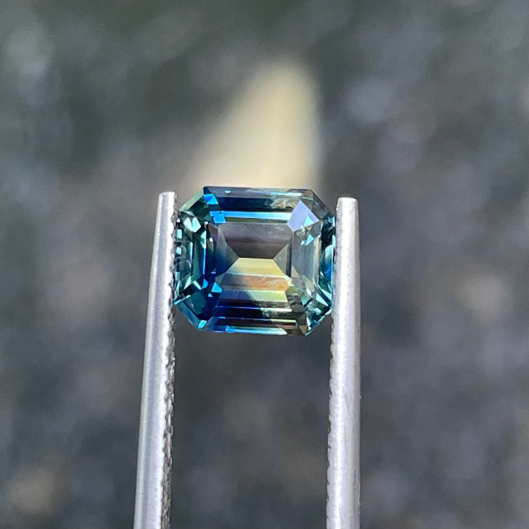 Natural 2.08 carat parti sapphire from Madagascar, cushion cut, unheated with a clean appearance, measuring 7.3 × 6.3 × 4.0 mm, loose earth-mined gemstone by Crystal Gem &amp; Jewelry.