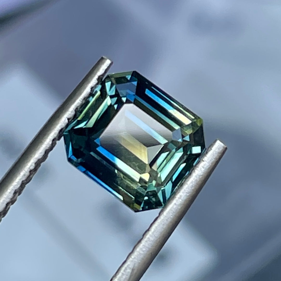 Natural 2.08 carat parti sapphire from Madagascar, cushion cut, unheated with a clean appearance, measuring 7.3 × 6.3 × 4.0 mm, loose earth-mined gemstone by Crystal Gem &amp; Jewelry.