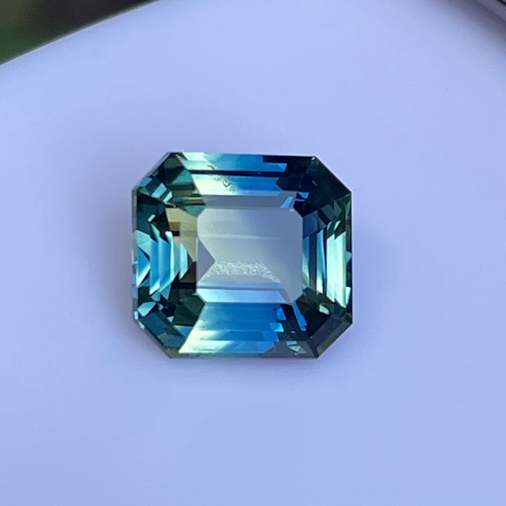 Natural 2.08 carat parti sapphire from Madagascar, cushion cut, unheated with a clean appearance, measuring 7.3 × 6.3 × 4.0 mm, loose earth-mined gemstone by Crystal Gem &amp; Jewelry.