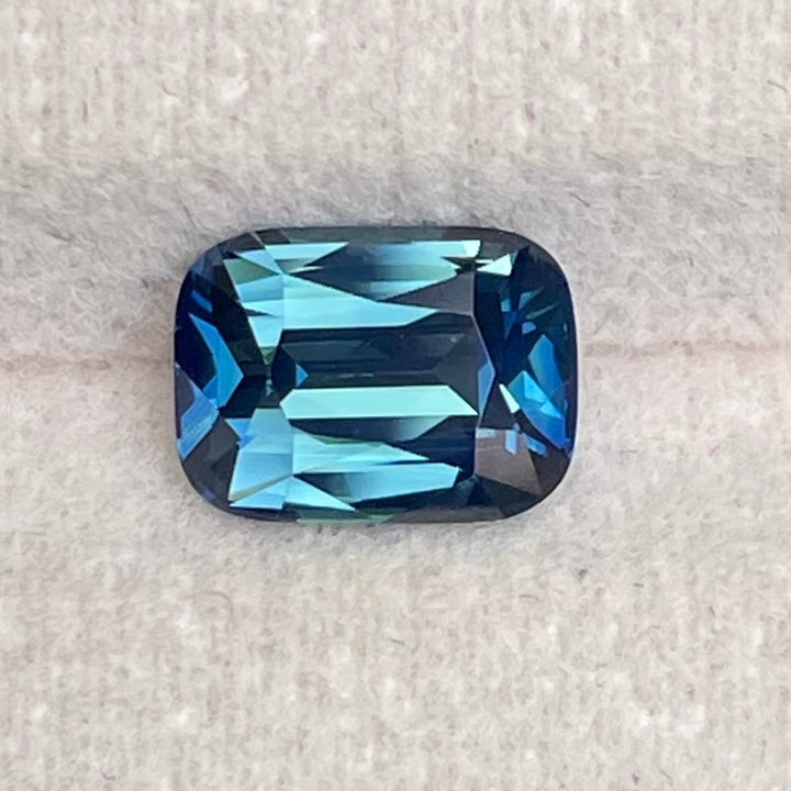 Natural 2.03 carat teal sapphire from Madagascar, radiant cut, unheated with a clean appearance, measuring 8 × 5.8 × 4.3 mm, loose earth-mined gemstone by Crystal Gem &amp; Jewelry.