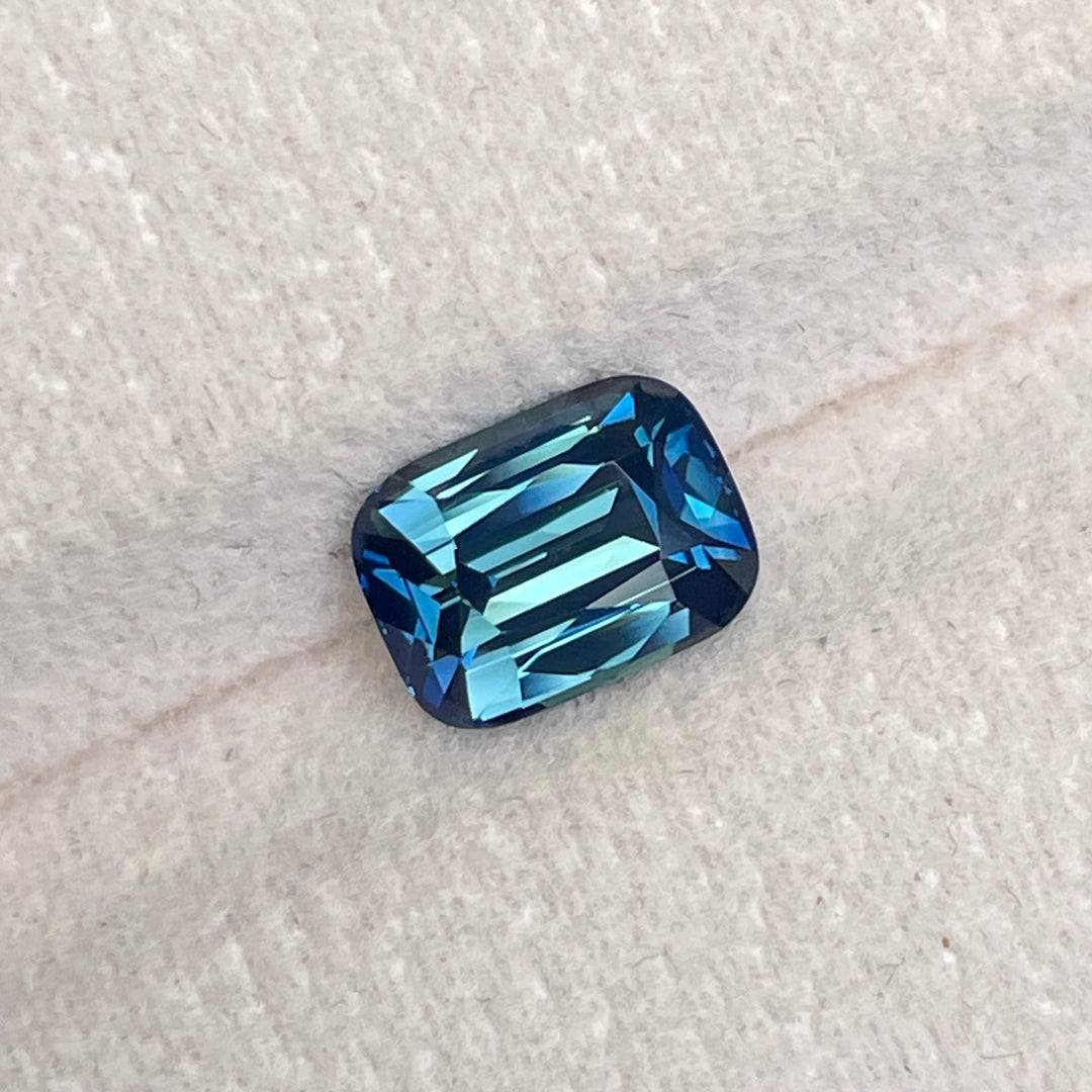 Natural 2.03 carat teal sapphire from Madagascar, radiant cut, unheated with a clean appearance, measuring 8 × 5.8 × 4.3 mm, loose earth-mined gemstone by Crystal Gem &amp; Jewelry.