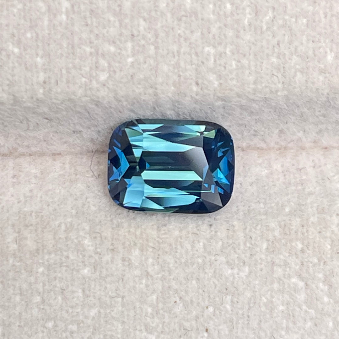 Natural 2.03 carat teal sapphire from Madagascar, radiant cut, unheated with a clean appearance, measuring 8 × 5.8 × 4.3 mm, loose earth-mined gemstone by Crystal Gem &amp; Jewelry.