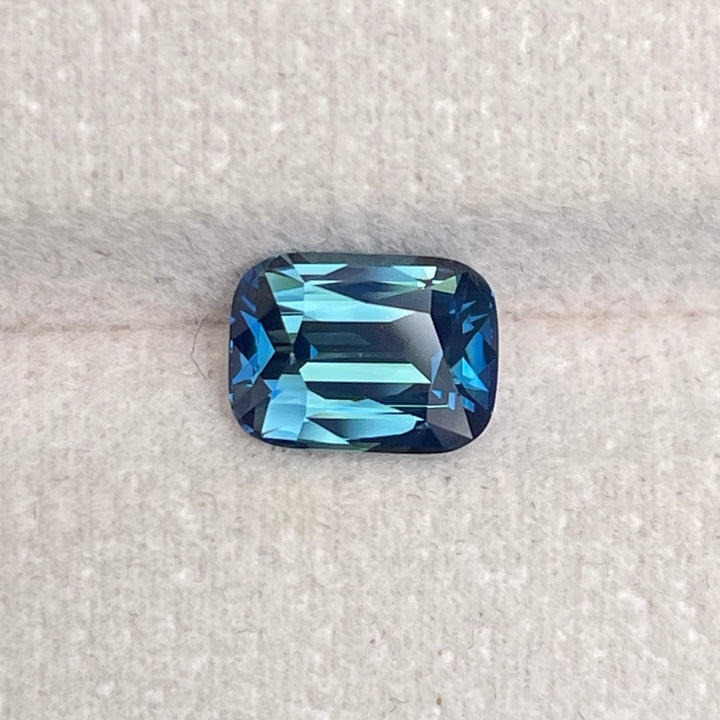 Natural 2.03 carat teal sapphire from Madagascar, radiant cut, unheated with a clean appearance, measuring 8 × 5.8 × 4.3 mm, loose earth-mined gemstone by Crystal Gem &amp; Jewelry.