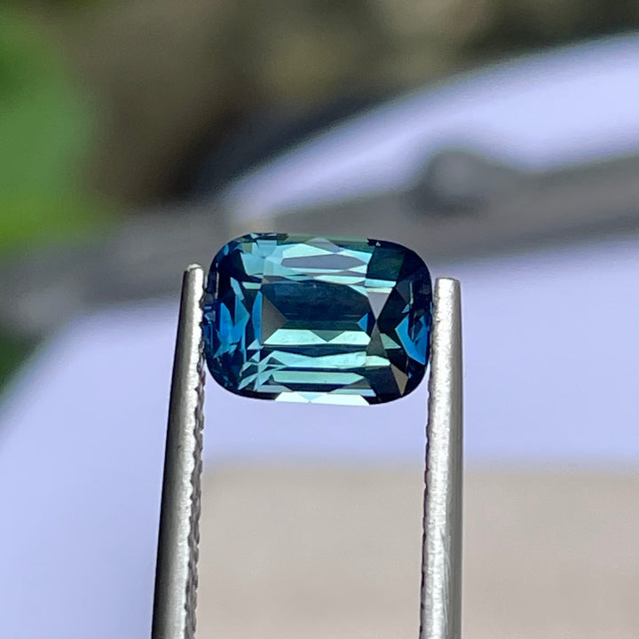 Natural 2.03 carat teal sapphire from Madagascar, radiant cut, unheated with a clean appearance, measuring 8 × 5.8 × 4.3 mm, loose earth-mined gemstone by Crystal Gem &amp; Jewelry.