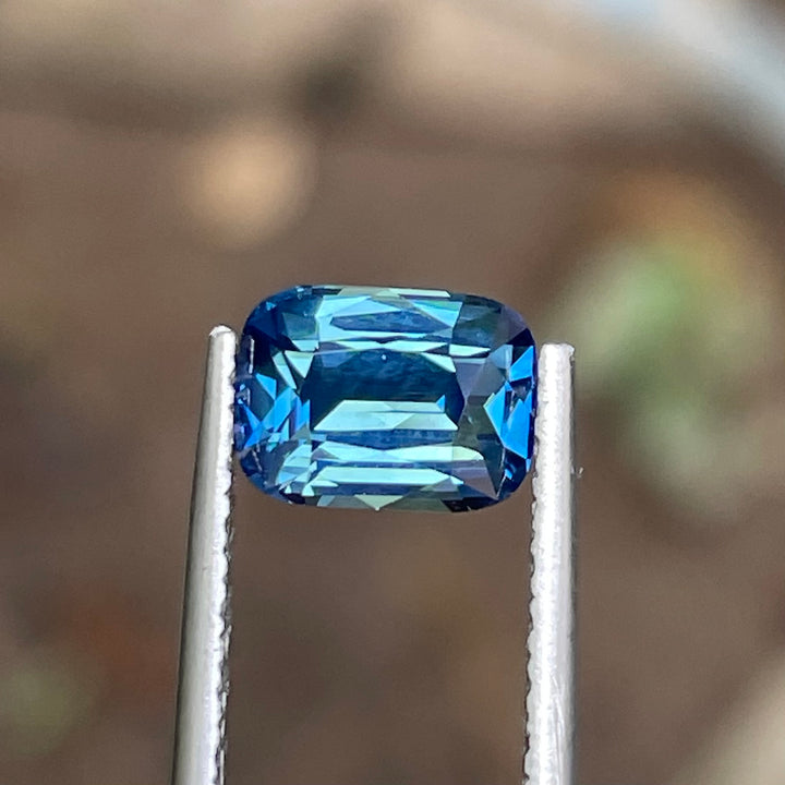 Natural 2.03 carat teal sapphire from Madagascar, radiant cut, unheated with a clean appearance, measuring 8 × 5.8 × 4.3 mm, loose earth-mined gemstone by Crystal Gem &amp; Jewelry.
