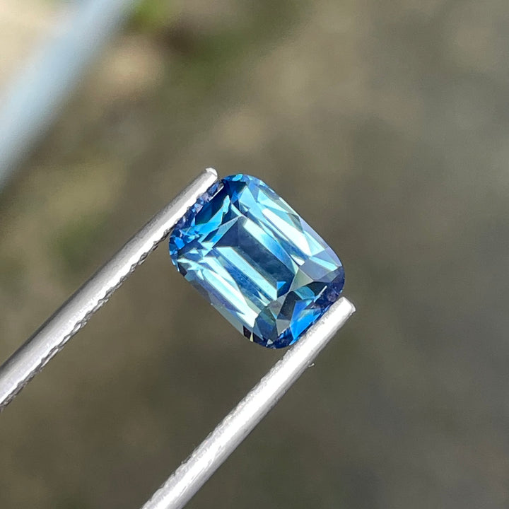 Natural 2.03 carat teal sapphire from Madagascar, radiant cut, unheated with a clean appearance, measuring 8 × 5.8 × 4.3 mm, loose earth-mined gemstone by Crystal Gem &amp; Jewelry.