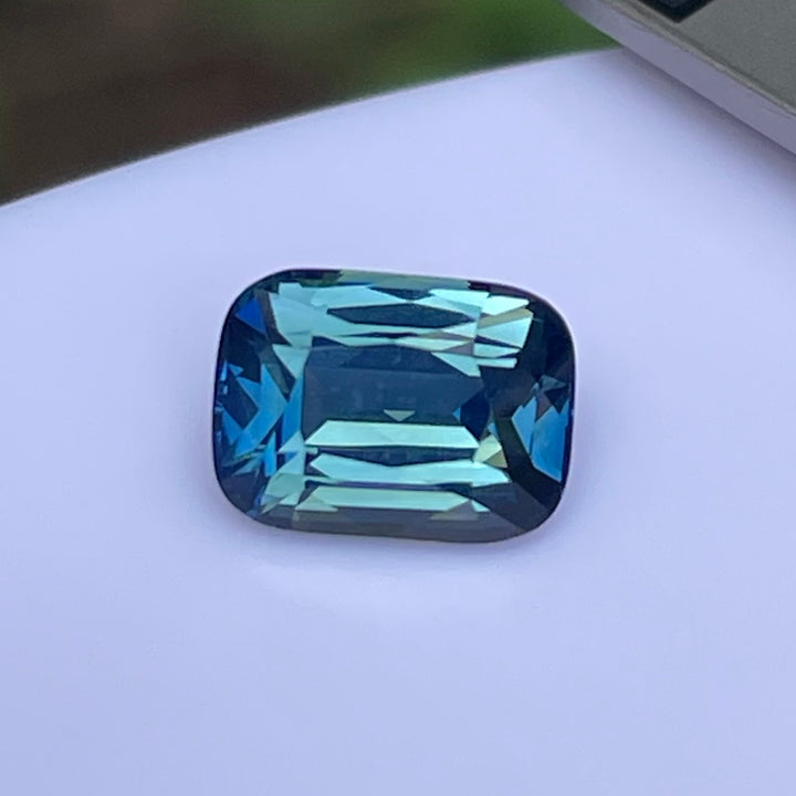 Natural 2.03 carat teal sapphire from Madagascar, radiant cut, unheated with a clean appearance, measuring 8 × 5.8 × 4.3 mm, loose earth-mined gemstone by Crystal Gem &amp; Jewelry.