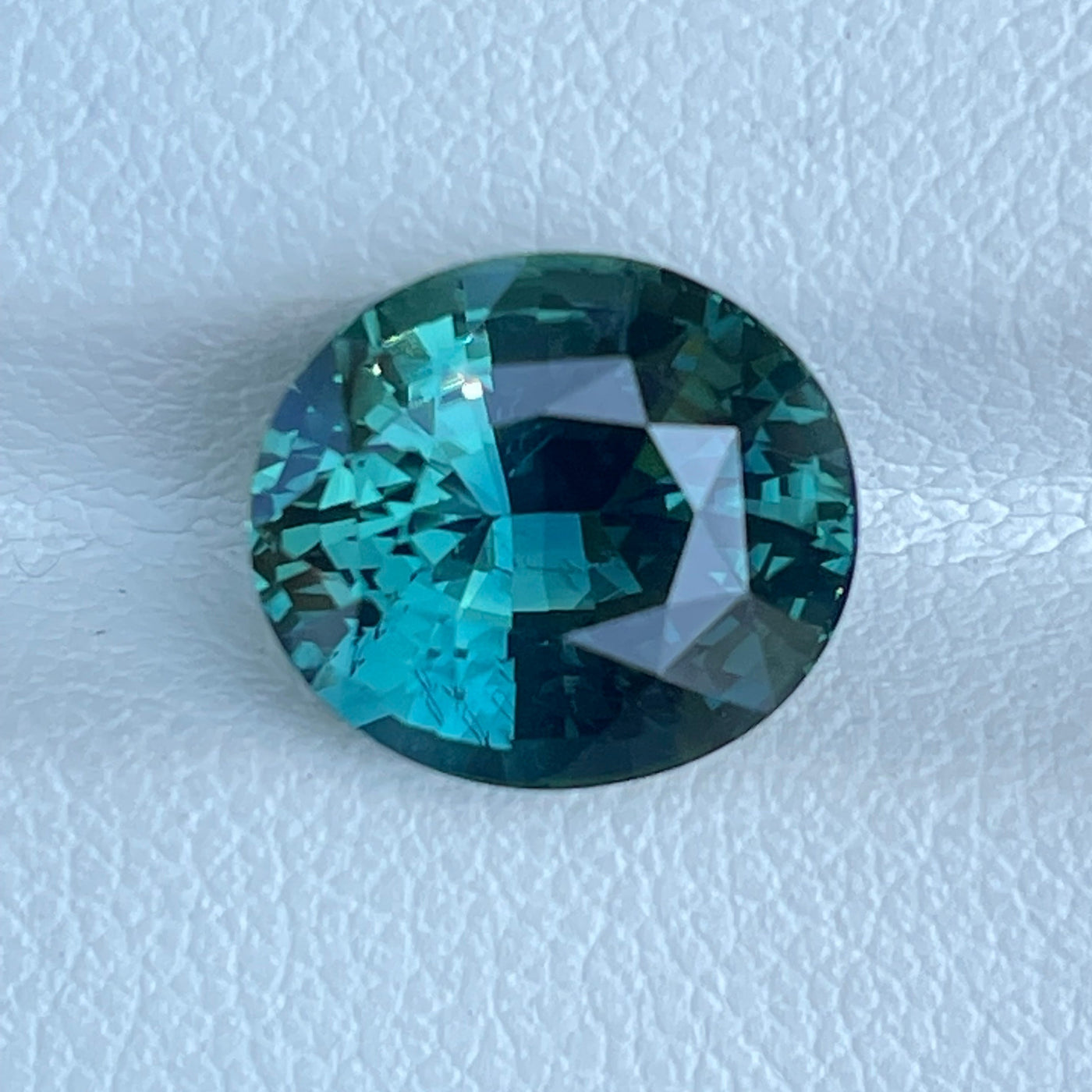 fine natural teal sapphire for bespoke engagement ring